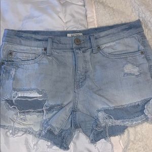 light wash ripped blue jean shorts